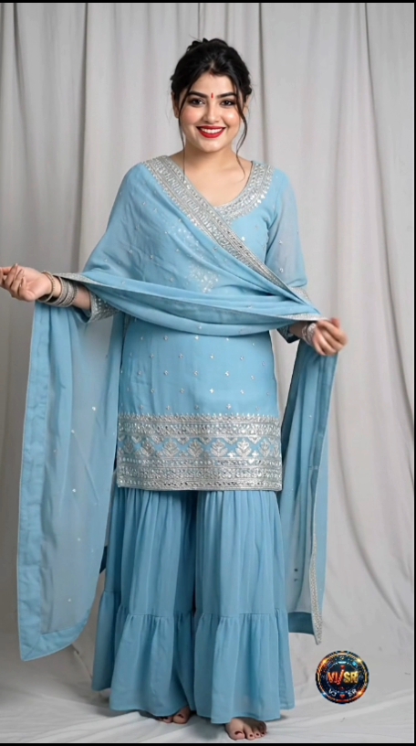 Women in light blue sharara suit
